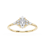 Gold ring with a marquise-shaped diamond and smaller diamonds on a white background