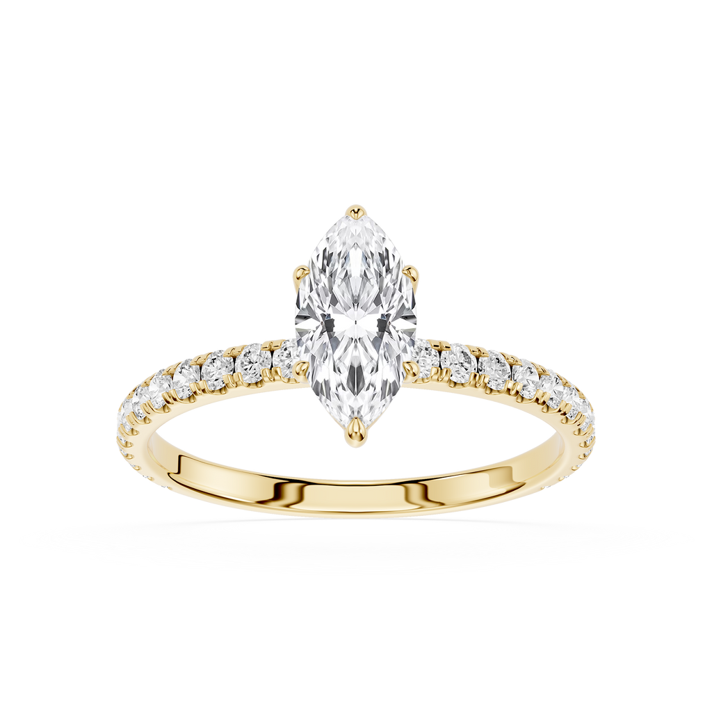 Gold ring with a pear-shaped diamond and smaller diamonds on a white background