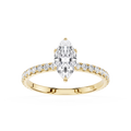Gold ring with a pear-shaped diamond and smaller diamonds on a white background