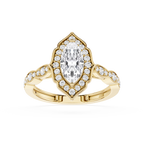 Gold ring with a pear-shaped diamond and smaller diamonds on a white background