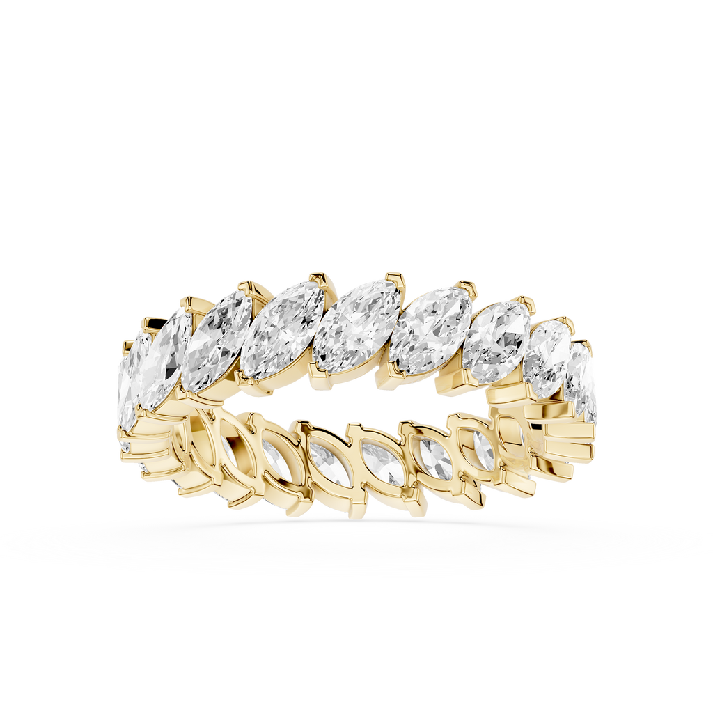 Gold ring with marquise-shaped diamonds on a white background