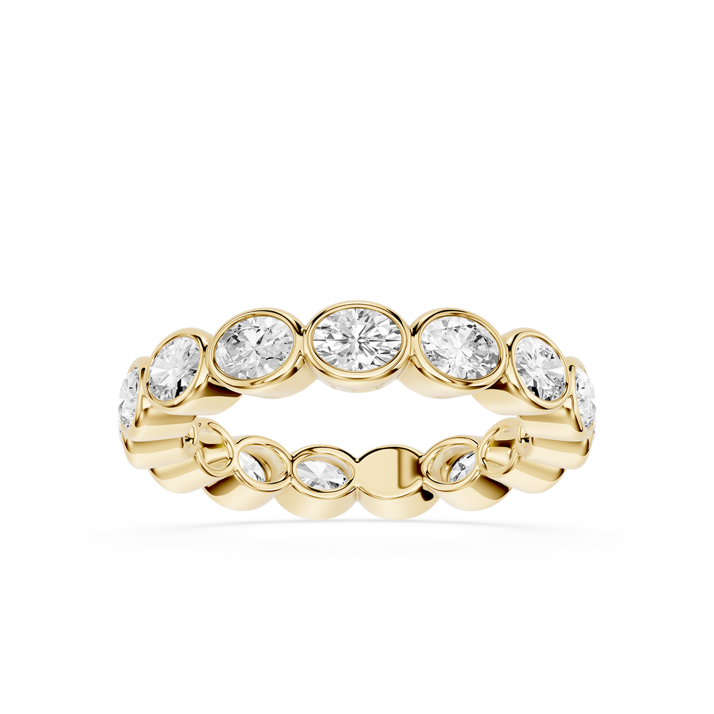 A yellow gold eternity ring featuring a row of round-cut clear gemstones in a bezel setting, shown against a plain white background.