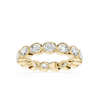 A yellow gold eternity ring featuring a row of round-cut clear gemstones in a bezel setting, shown against a plain white background.