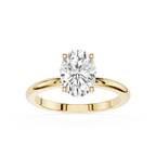 Gold ring with a large diamond on a white background