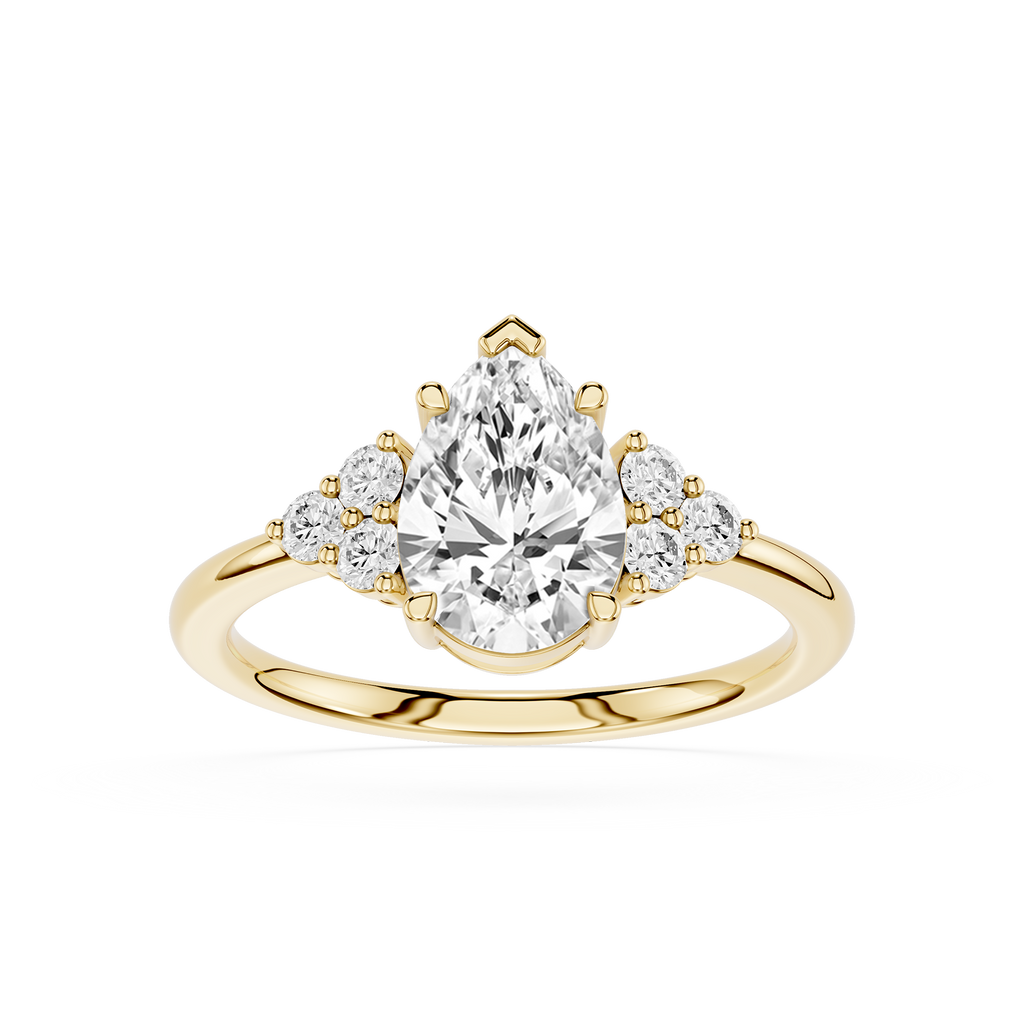 Gold ring with a pear-shaped diamond and smaller diamonds on a white background