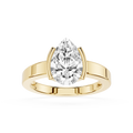 Gold ring with a pear-shaped diamond on a white background