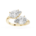 Gold ring with two pear-shaped diamonds on a white background