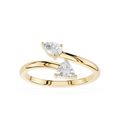 A yellow gold ring featuring two triangular-cut clear gemstones in a split-band design, set against a plain white background.
