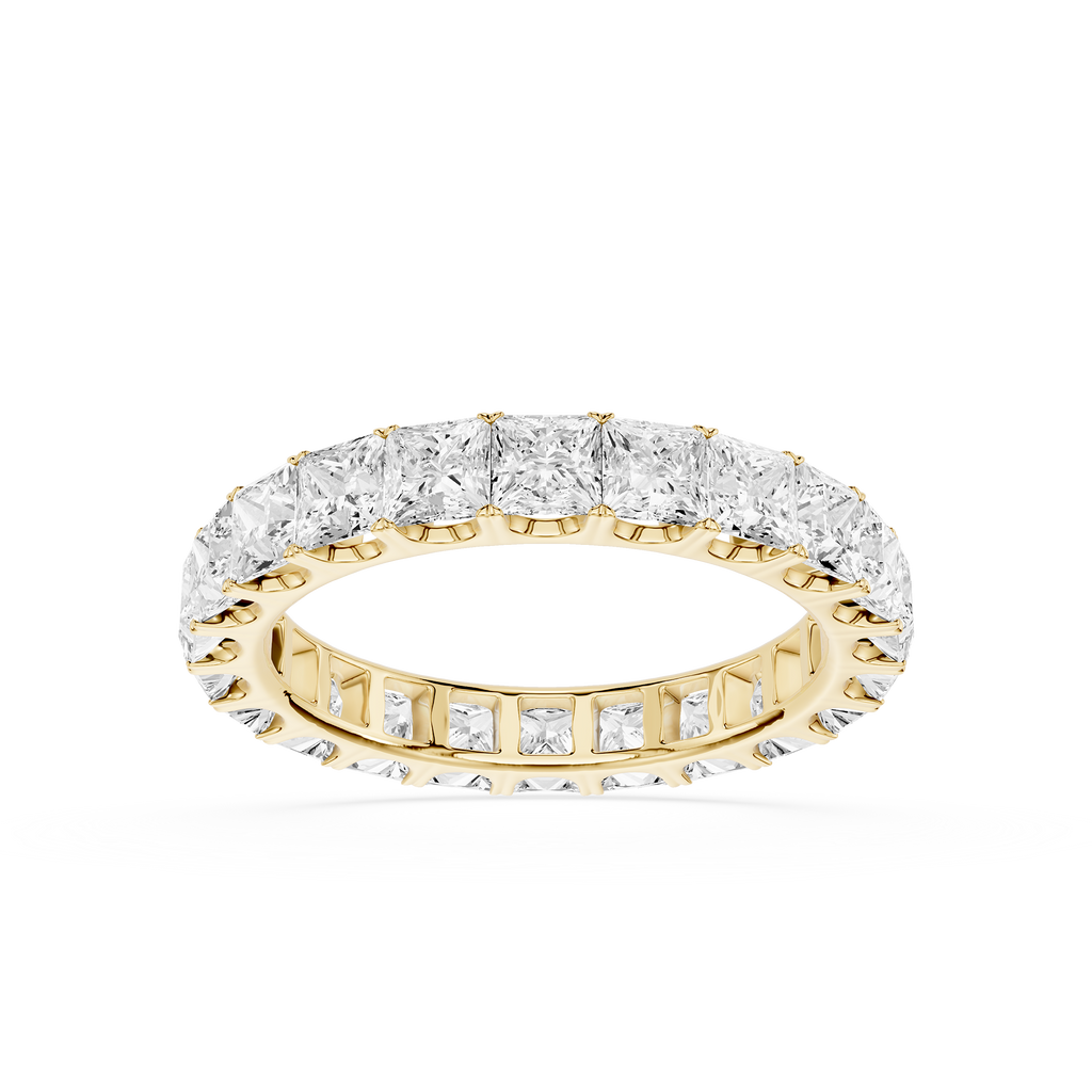 A yellow gold eternity ring set with round brilliant-cut diamonds, shown on a clean white background.