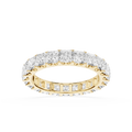 A yellow gold eternity ring set with round brilliant-cut diamonds, shown on a clean white background.