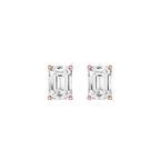 Pair of emerald-cut diamond stud earrings with rose gold prongs on a white background