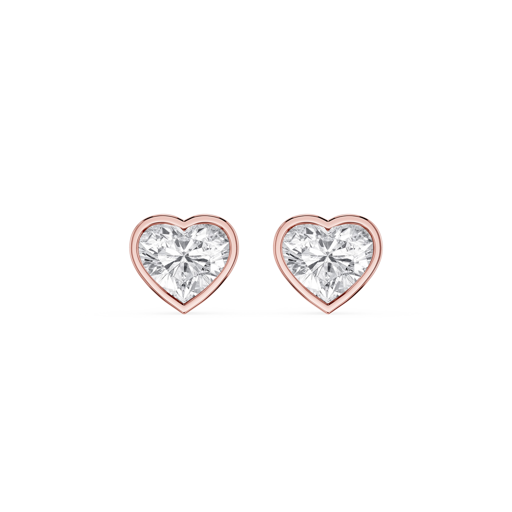 Heart-shaped diamond earrings with rose gold setting on a white background