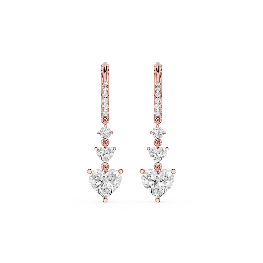 Rose gold and diamond earrings on a white background