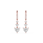Rose gold and diamond earrings on a white background