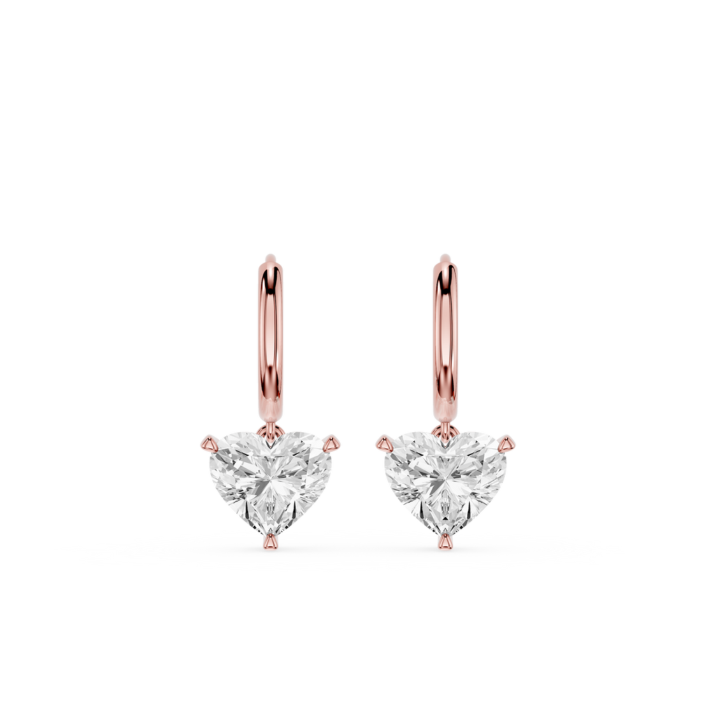 Rose gold heart-shaped diamond earrings on a white background