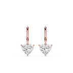 Rose gold heart-shaped diamond earrings on a white background