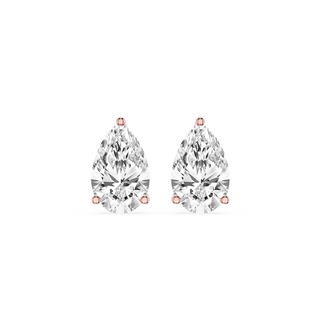 Pair of pear-shaped diamond earrings on a white background