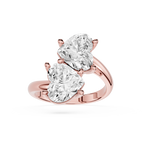 A rose gold ring featuring two large pear-cut clear gemstones in a split-prong setting, shown on a clean white background.