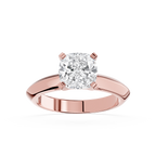 Rose gold ring with a large diamond on a white background