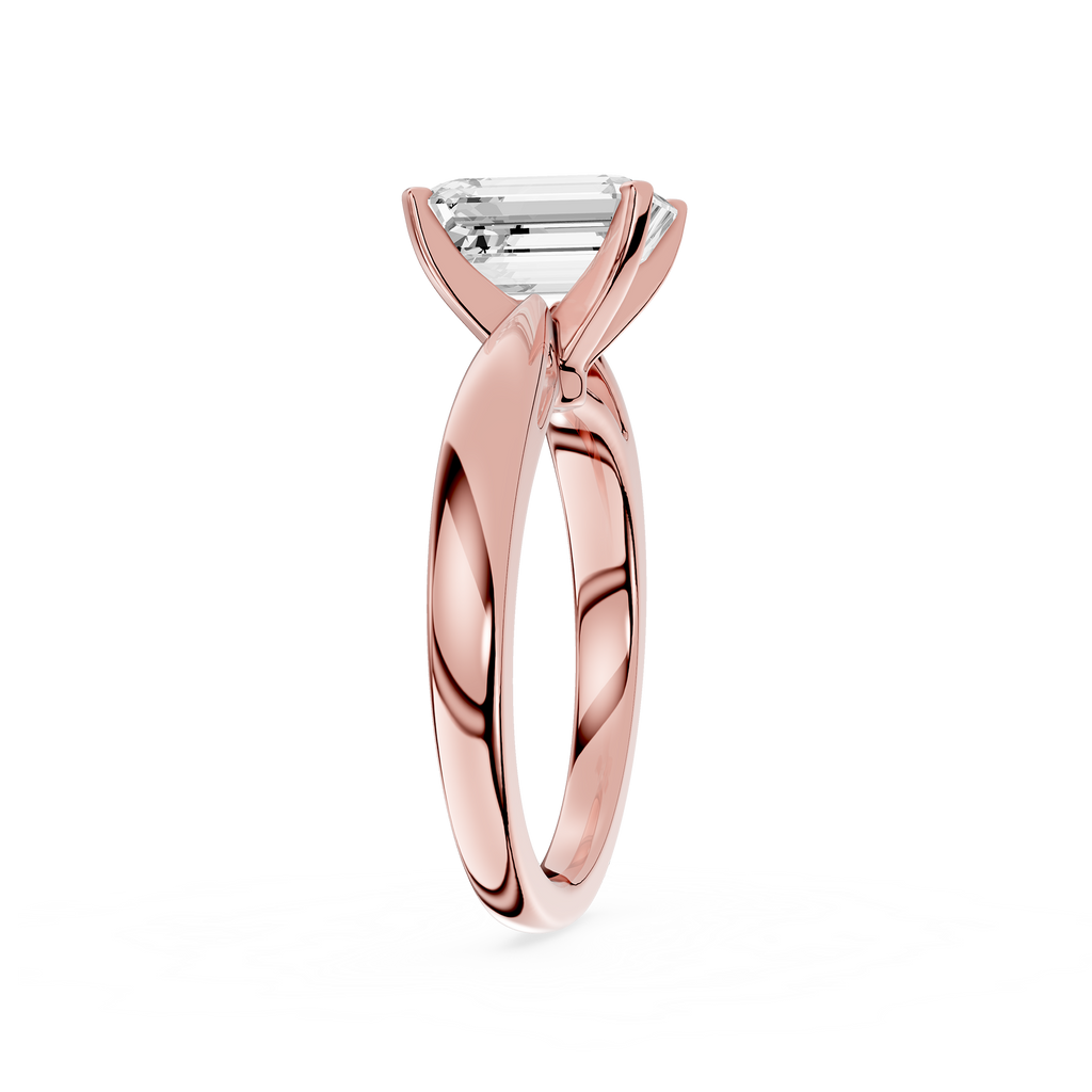 Rose gold ring with a diamond on a white background