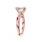 Rose gold ring with a diamond on a white background
