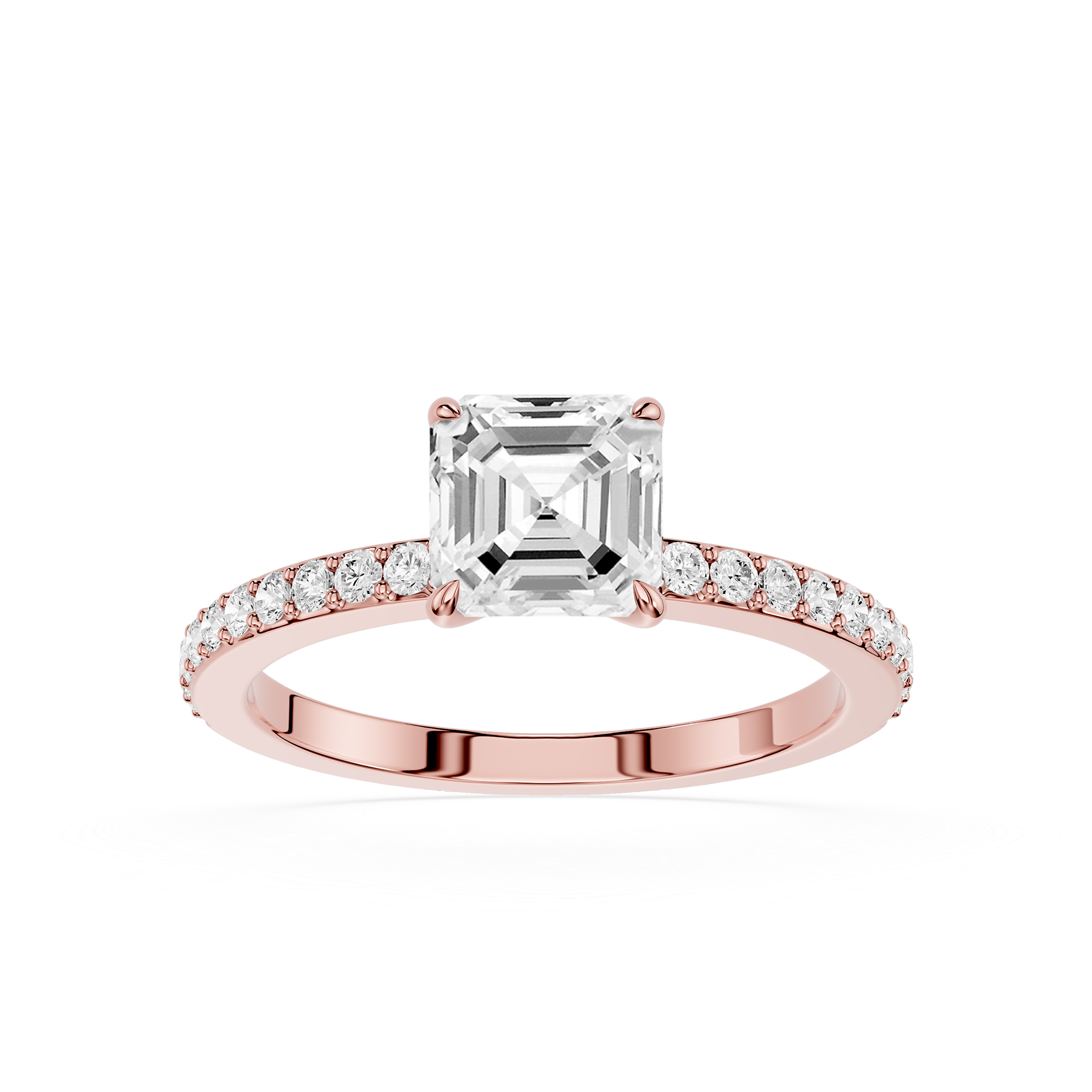 An emerald-cut diamond engagement ring in a Rose-colored metal setting, featuring a pave  band with small round diamonds, shot against a solid white background.