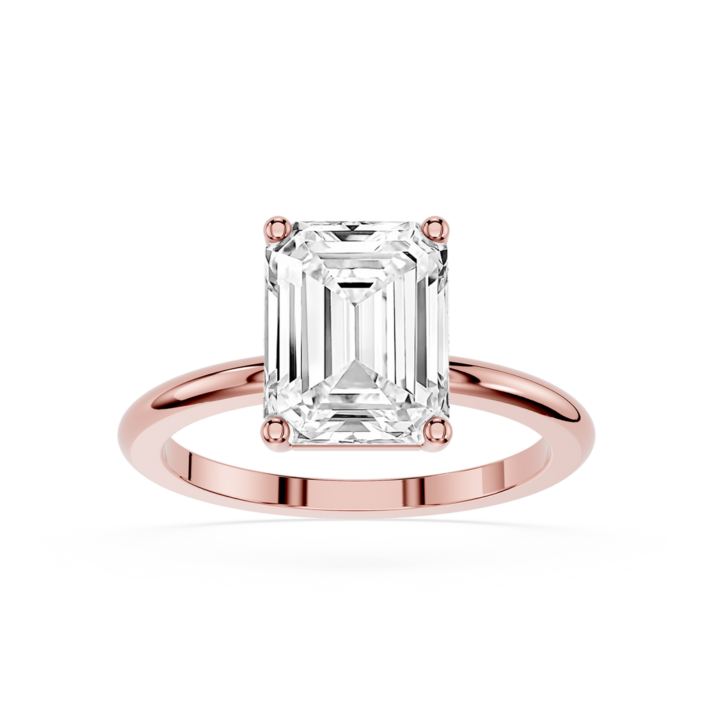 Rose gold ring with a large emerald-cut diamond on a white background