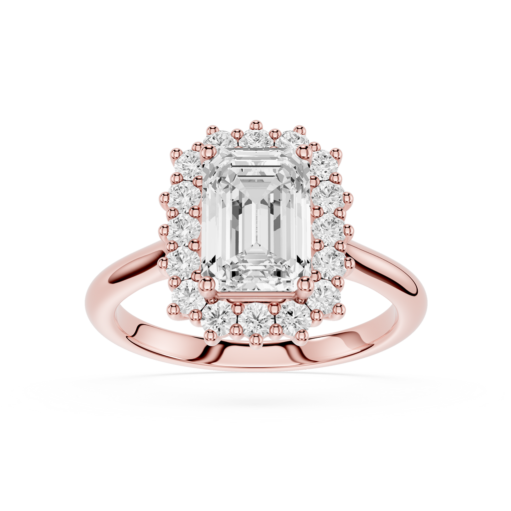 Rose gold halo ring featuring an emerald-cut center diamond surrounded by a double halo of smaller round and baguette-cut diamonds, set on a polished rose gold band against a white background.