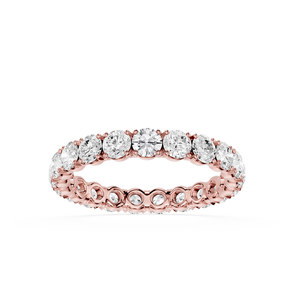 A rose gold eternity ring featuring a continuous row of round-cut clear gemstones in a prong setting, shown against a solid white background.