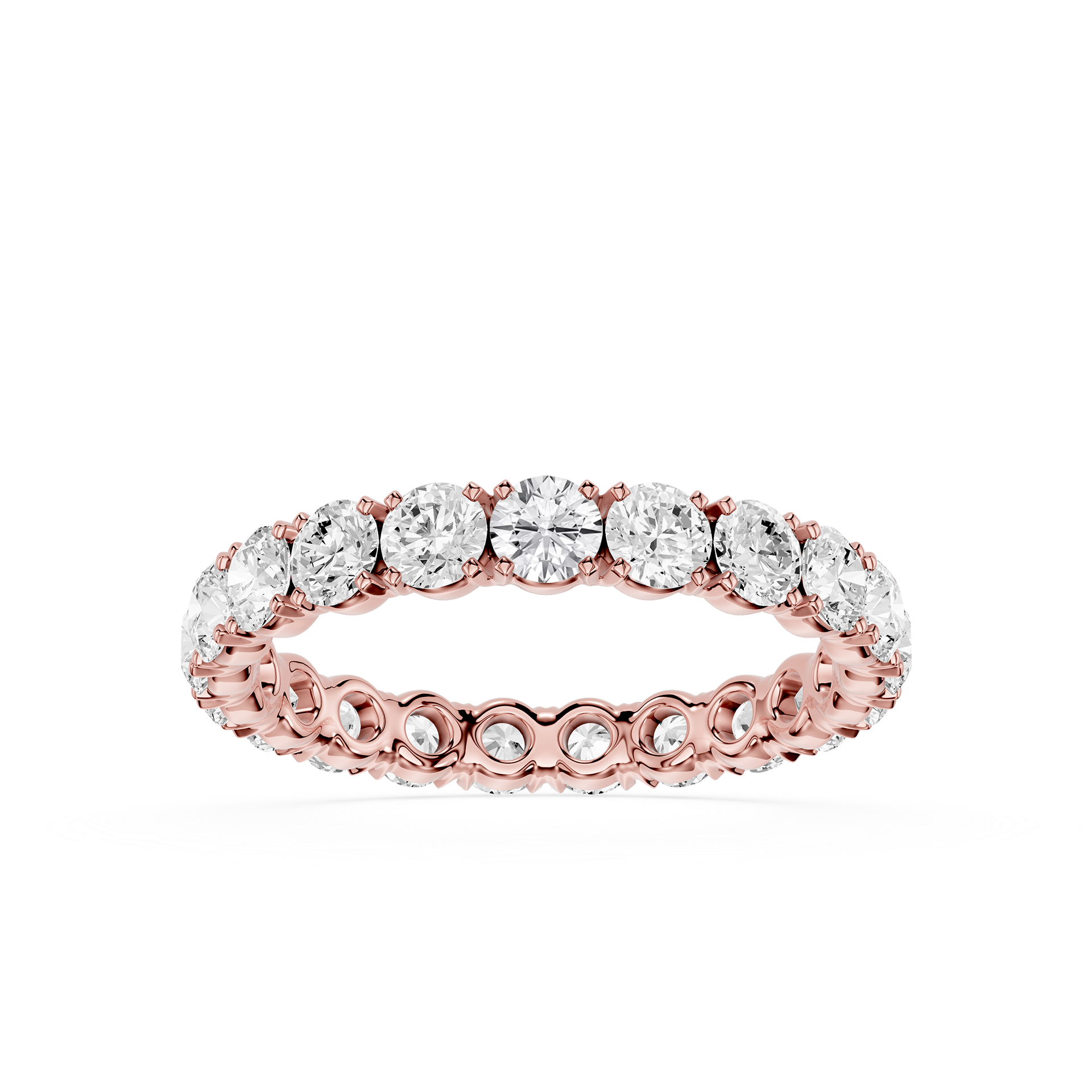 A rose gold eternity ring featuring a continuous row of round-cut clear gemstones in a prong setting, shown against a solid white background.