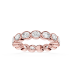 A Rose gold eternity ring featuring a row of round-cut clear gemstones in a bezel setting, shown against a plain white background.