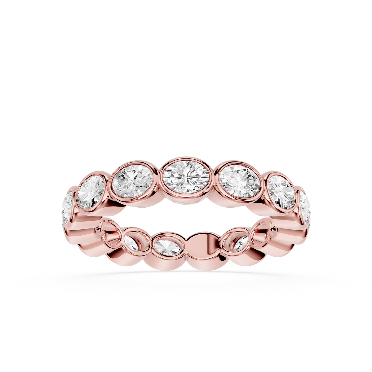 Rose gold eternity band adorned with bezel-set oval lab grown diamonds, creating a continuous design with soft curves and balanced proportions.
