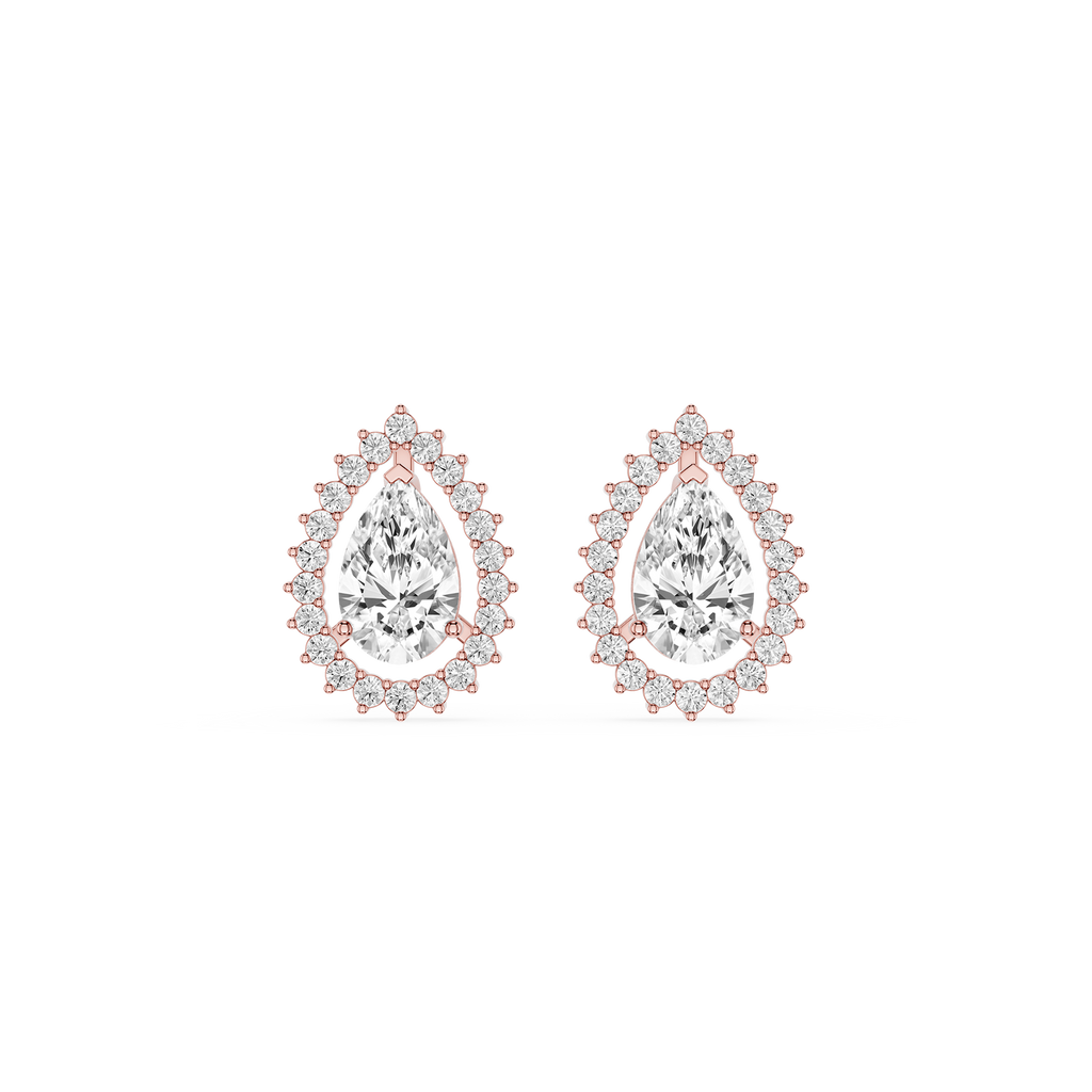 Pair of pear-shaped diamond earrings with rose gold accents on a white background