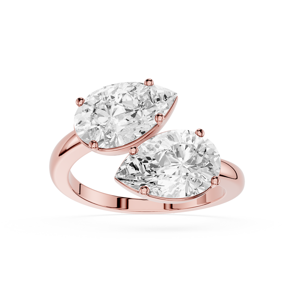 Rose gold ring with two pear-shaped diamonds on a white background