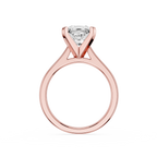 Rose gold ring with a diamond on a white background