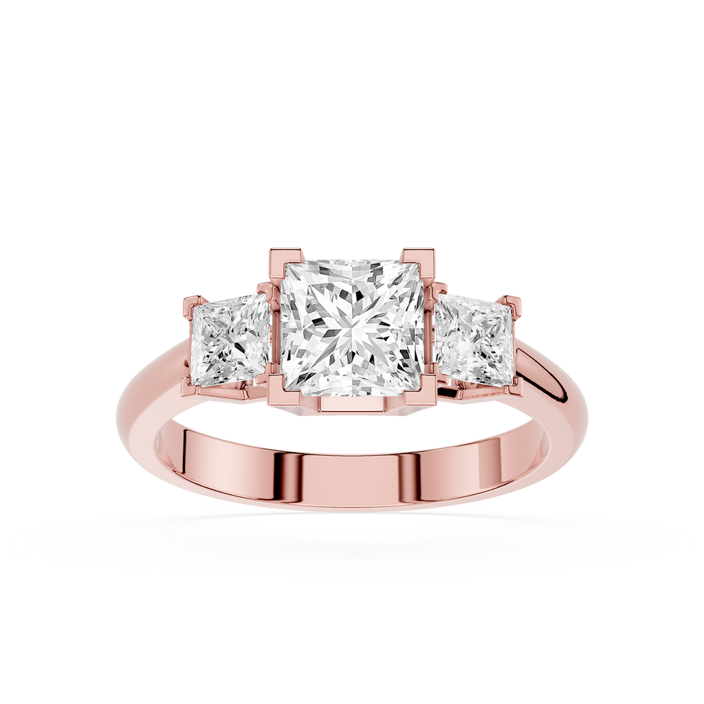 Rose gold ring with three princess-cut diamonds on a white background
