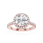 Rose gold ring with a large diamond and smaller diamonds on the band against a white background