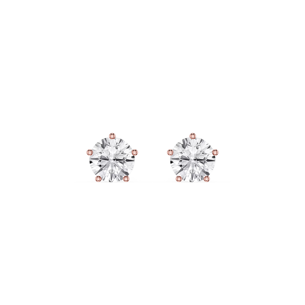 Pair of diamond stud earrings on a white background