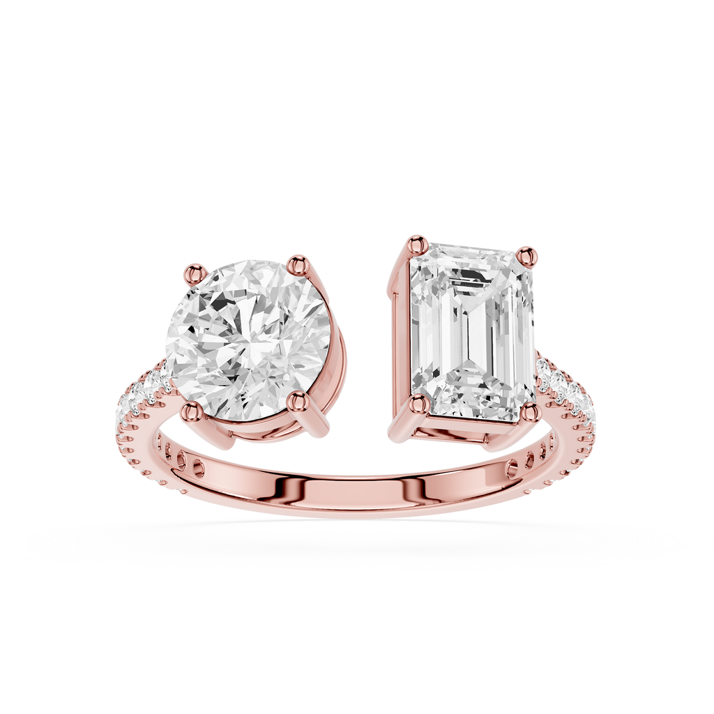 A rose gold split-shank engagement ring featuring a round brilliant-cut diamond on one side and an emerald-cut diamond on the other, set against a clean white background.