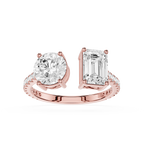 A rose gold split-shank engagement ring featuring a round brilliant-cut diamond on one side and an emerald-cut diamond on the other, set against a clean white background.