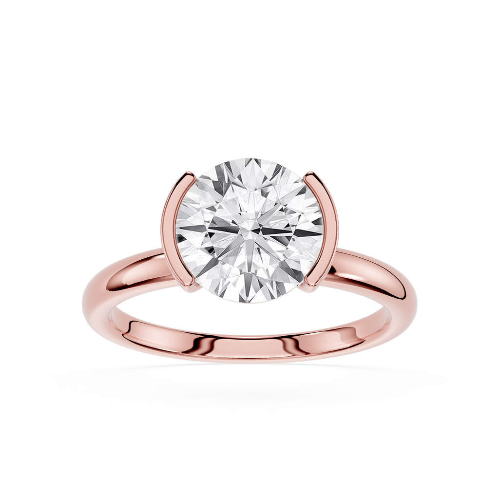 Rose gold ring with a large diamond on a white background