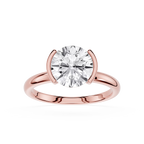 Rose gold ring with a large diamond on a white background