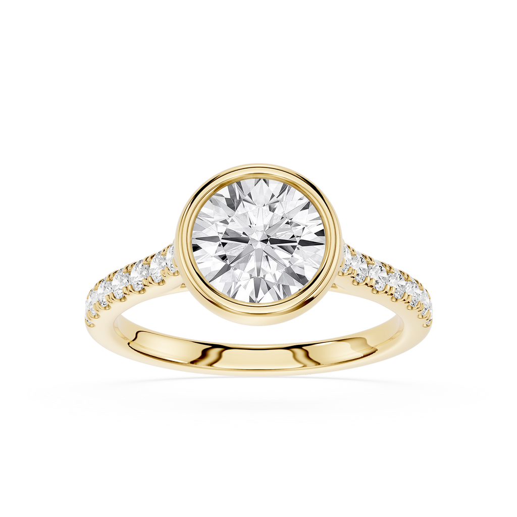 A yellow gold ring featuring a large round brilliant-cut center stone and a pavé-set band with small accent stones, shown on a clean white background.