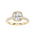 A yellow gold ring featuring a large round brilliant-cut center stone and a pavé-set band with small accent stones, shown on a clean white background.