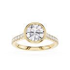 A yellow gold ring featuring a large round brilliant-cut center stone and a pavé-set band with small accent stones, shown on a clean white background.