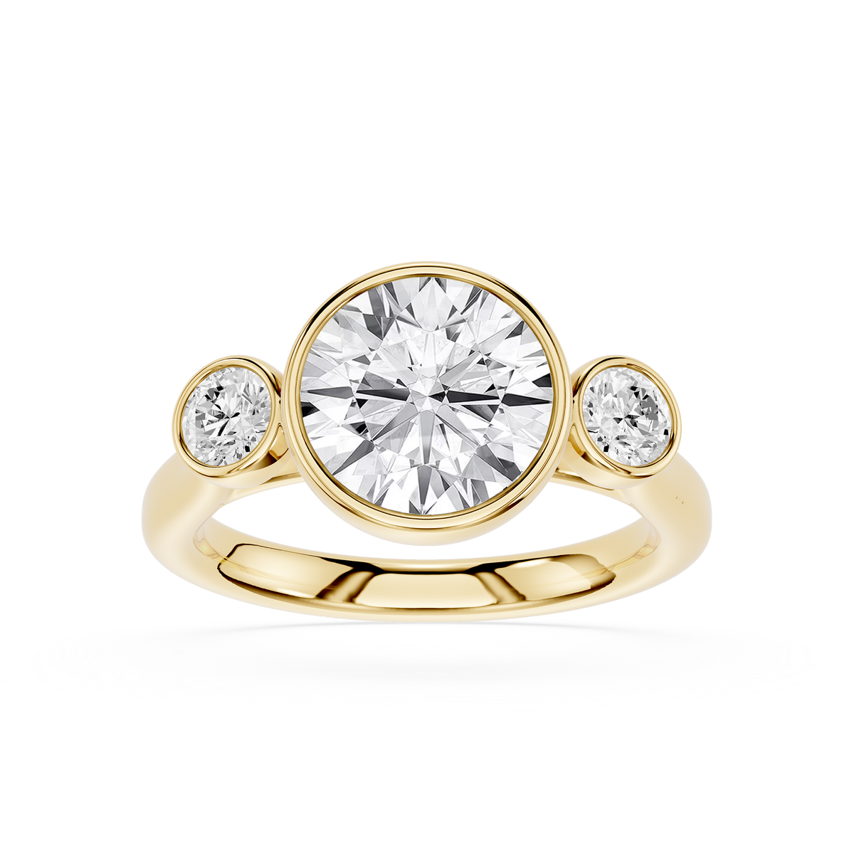 Round cut lab grown diamond bezel three stone engagement ring in yellow gold with matching side diamonds, modern bridal jewelry for women