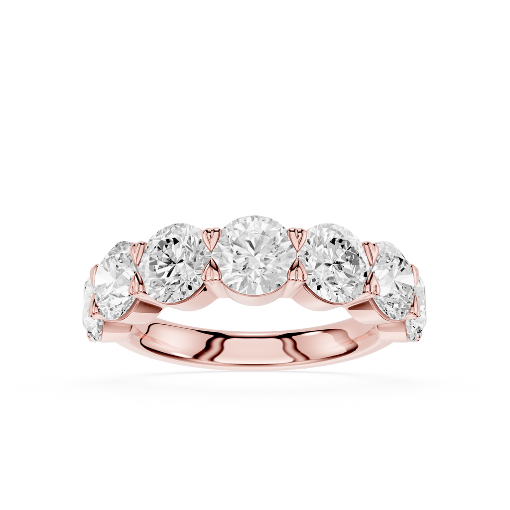 A rose gold five-stone diamond band ring with five round-cut diamonds set in a polished rose gold band, shown on a clean white background.