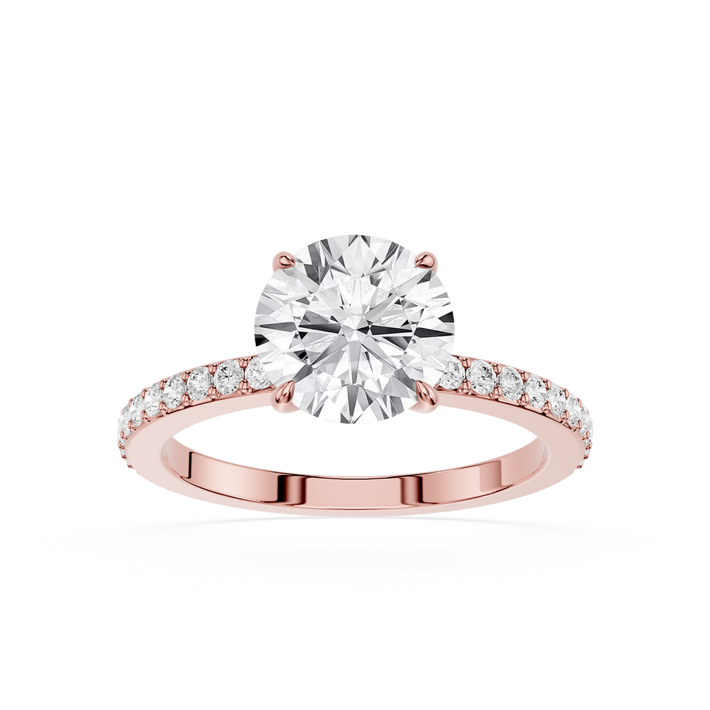 A rose gold engagement ring featuring a round brilliant-cut diamond center stone and a pavé-set diamond band, shown on a clean white background.