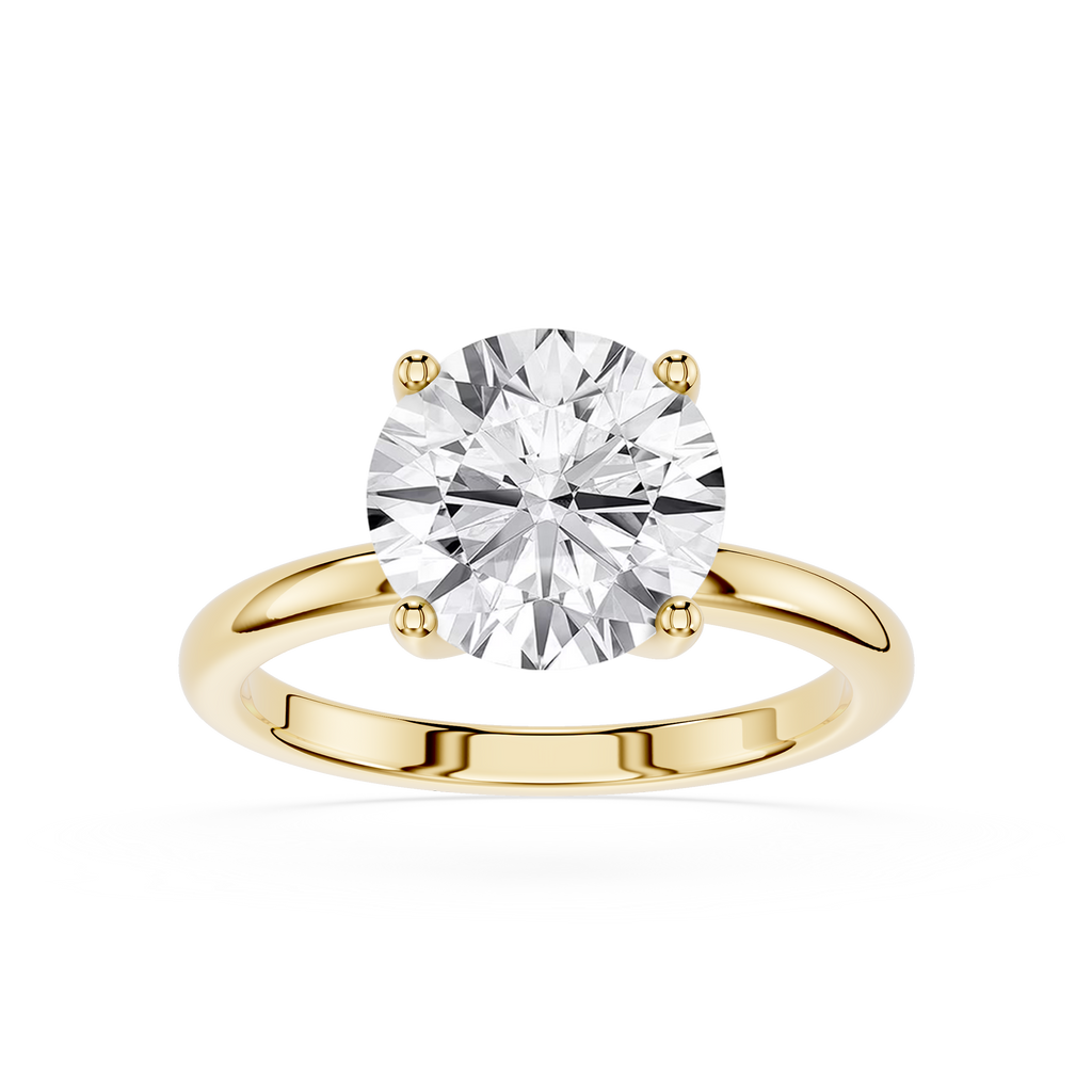 Gold ring with a large diamond on a white background