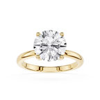 Gold ring with a large diamond on a white background